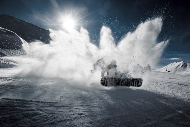 Positive Travel Best Sustainable Ski Resorts in Switzerland Davos snowboarding in slow powder